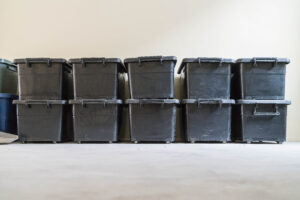 Peerless - Storage totes or bins in a garage.