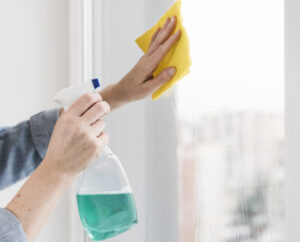 Peerless - Person Cleaning Window